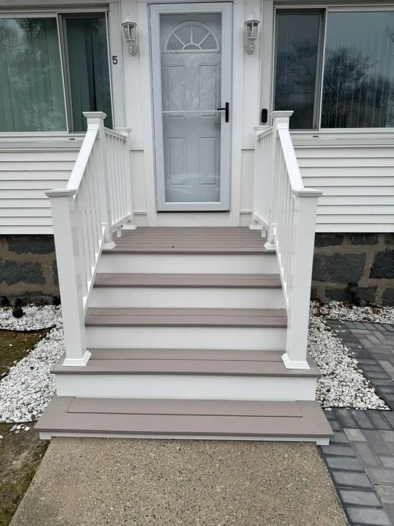 Finish carpentry detail on white porch steps