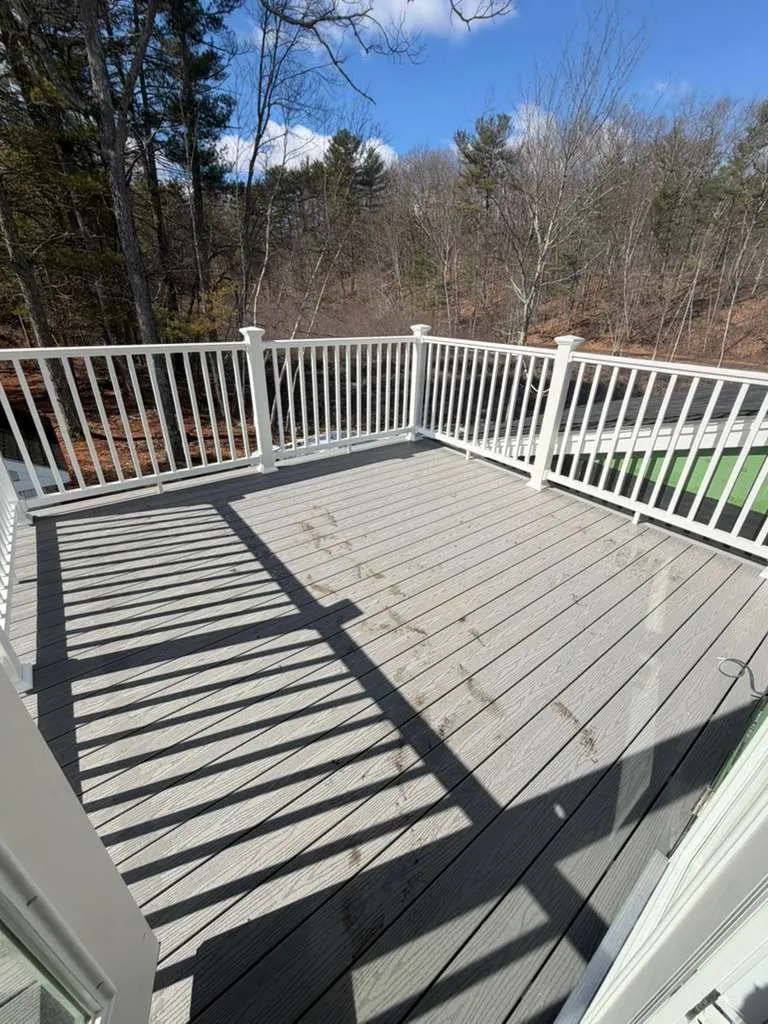 Composite deck with white railing built in Massachusetts