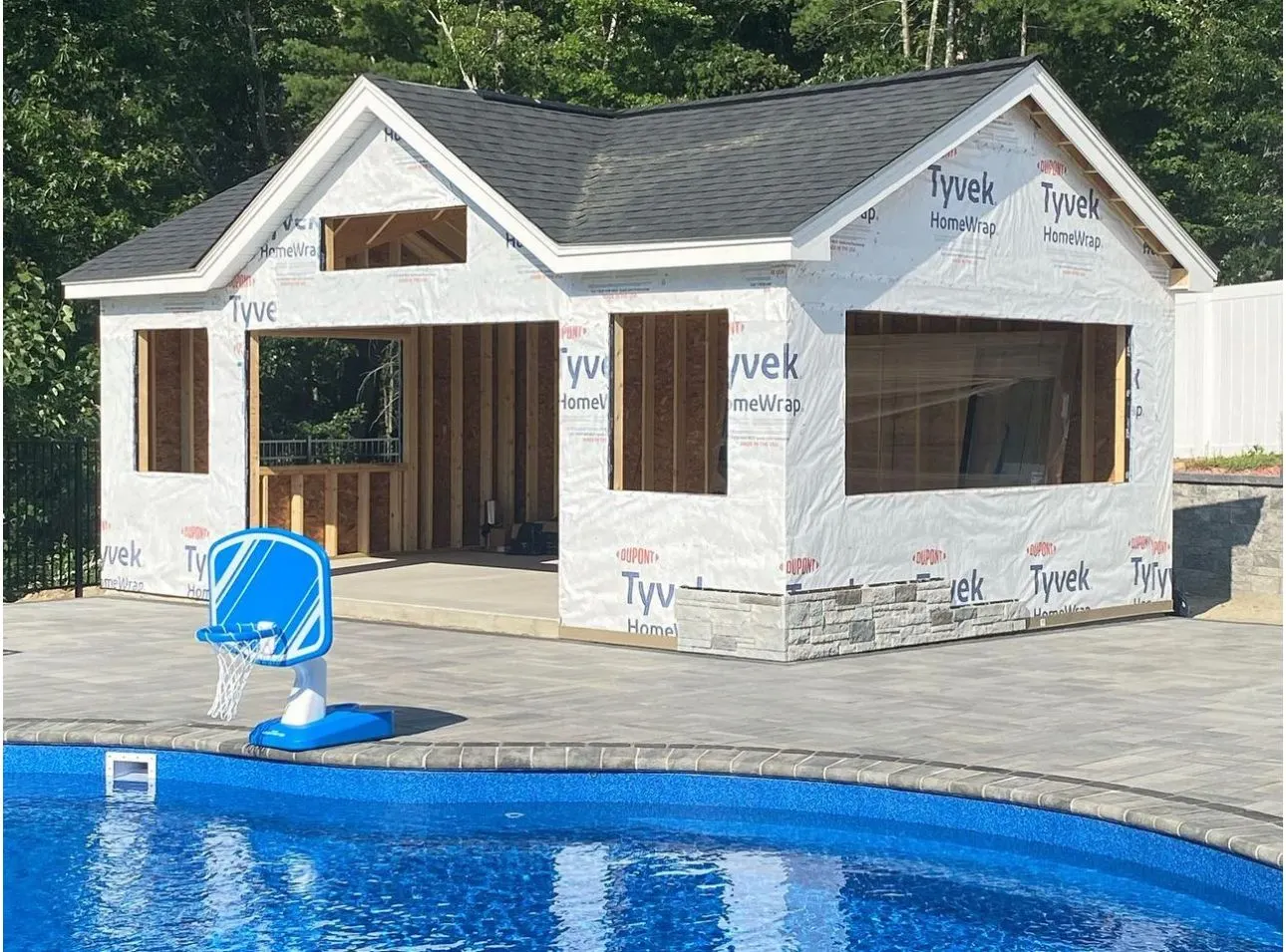 Pool house framing before siding and stone veneer